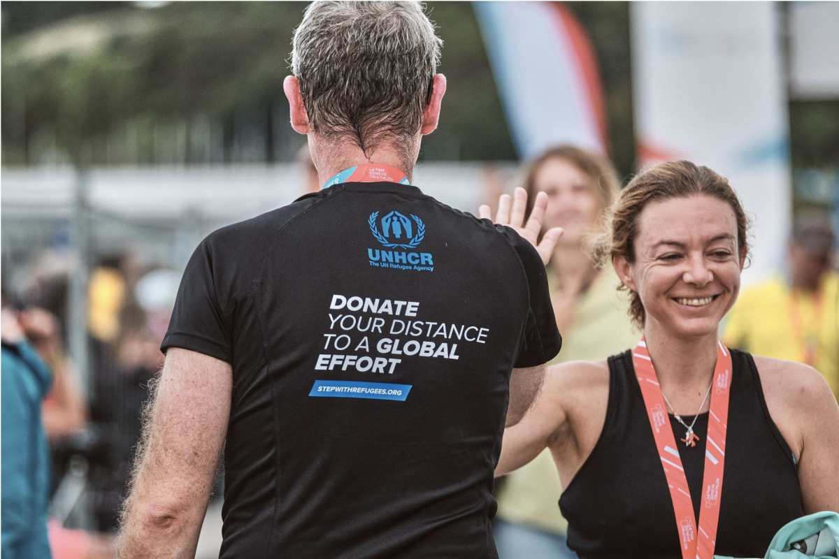 Members of the Switzerland for UNHCR team meet at the finish line after the race. © La Tour Genève Triathlon