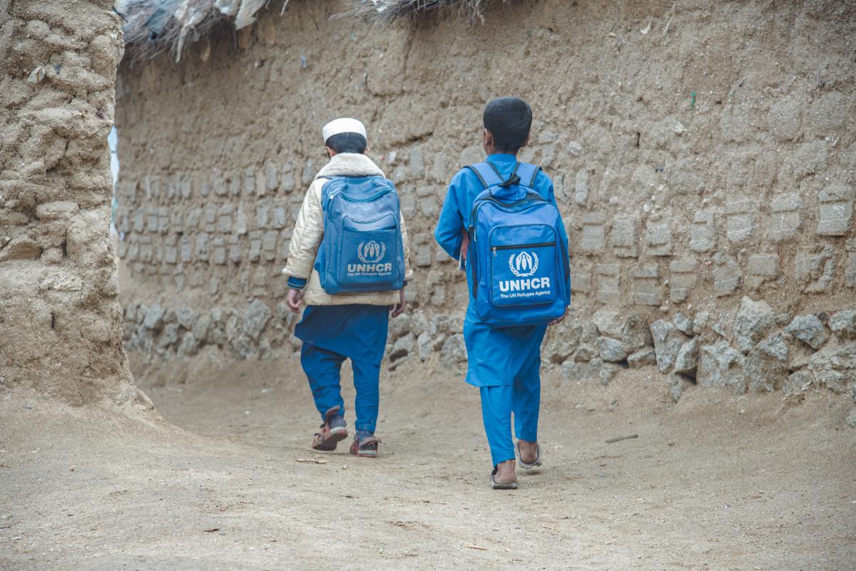 Yasser and Khalil, two Afghan refugees, set off for school. UNHCR/Muhammad Rahim Mirza
