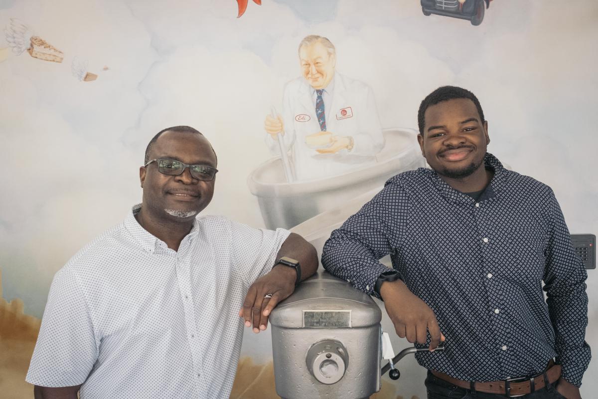 Elias Kasongo and his son both work for Eli's Cheesecake Factory in Chicago. Elias says, he'd found a home in the company.