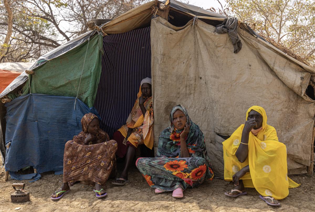 Sudanese refugees in front of a shelter in the Benishangul-Gumuz region in north-western Ethiopia.