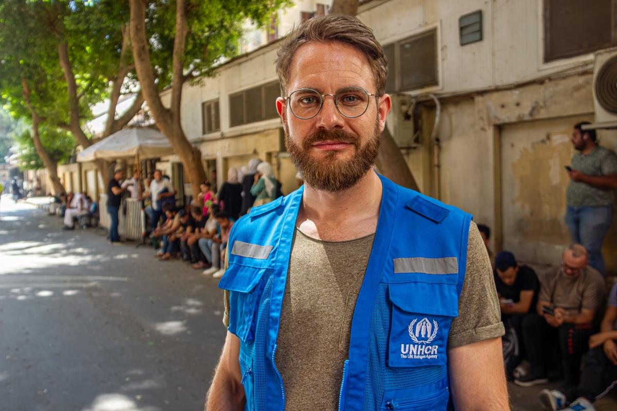 Sebastian Herwig stands in front of the UNHCR registration centre in Zamalek, Cairo.
