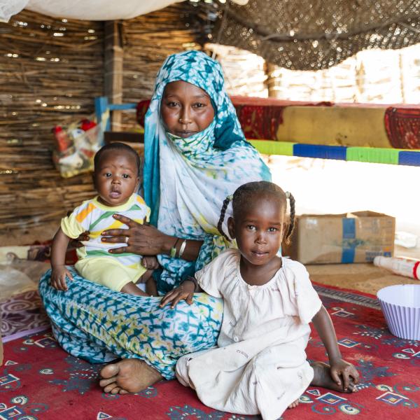 A Sudanese refugee with her children in a refugee camp in Chad